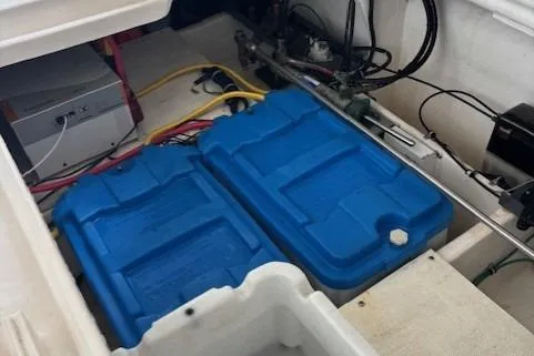 Ocean Cloud Yacht Photos Pics 2001 Tiara Yachts 3500 Open engine compartment with blue battery covers and wiring.