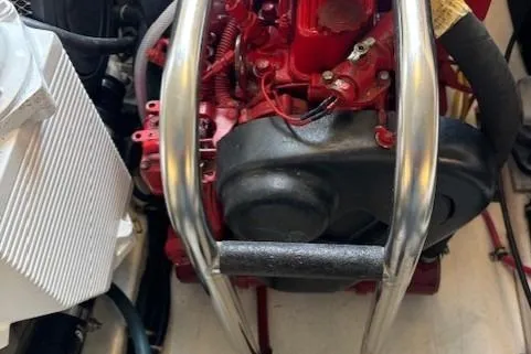 Ocean Cloud Yacht Photos Pics Engine compartment of a 2001 Tiara Yachts 3500 Open, showcasing red engine components.