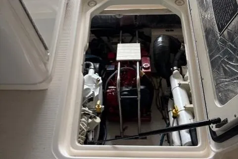Ocean Cloud Yacht Photos Pics Engine compartment of a 2001 Tiara Yachts 3500 Open, showcasing mechanical components.