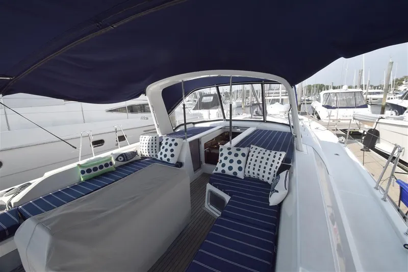  Yacht Photos Pics 2019 Beneteau 51.1 yacht cockpit with blue-striped seating and polka dot cushions.