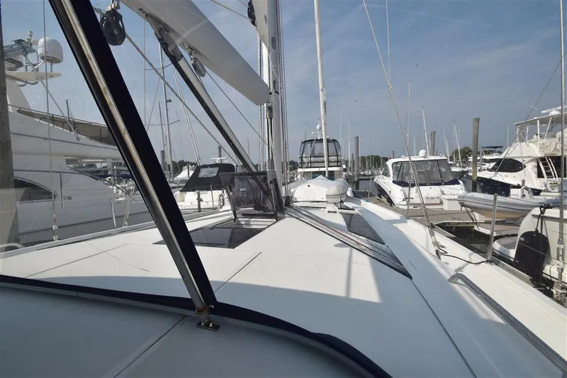  Yacht Photos Pics 2019 Beneteau 51.1 yacht docked at marina, showcasing sleek deck design.