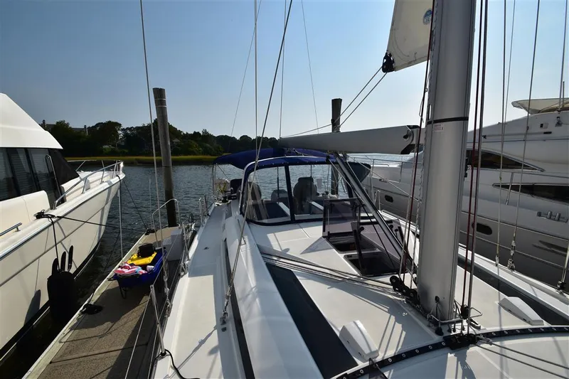  Yacht Photos Pics 2019 Beneteau 51.1 sailboat docked, featuring sleek design and spacious deck.