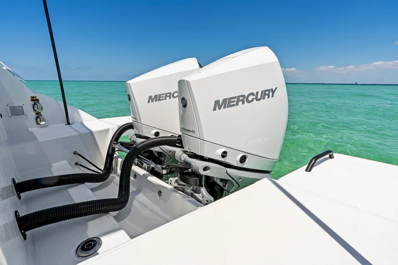  Yacht Photos Pics 2025 Beneteau Flyer 9 SUNdeck with dual Mercury outboard engines on turquoise water.