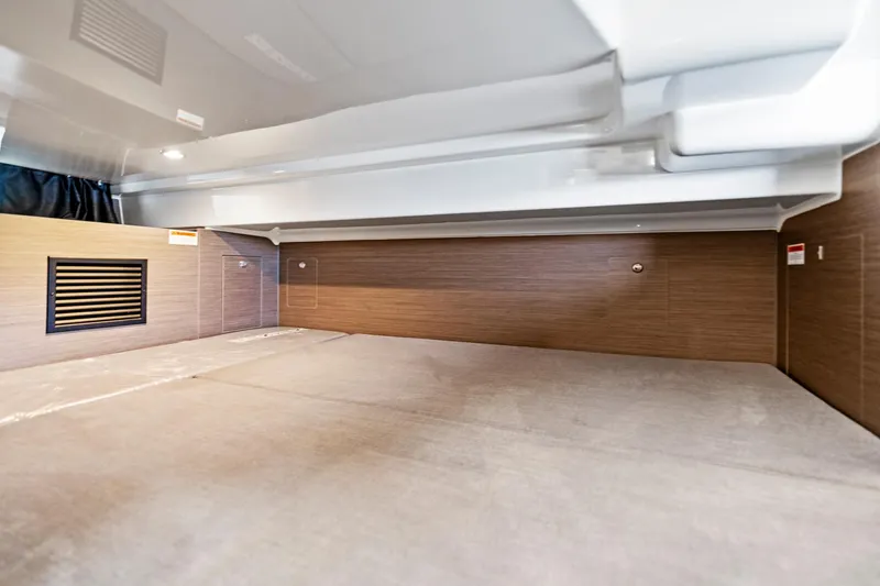  Yacht Photos Pics 2025 Beneteau Flyer 9 SUNdeck interior cabin with modern wood paneling.