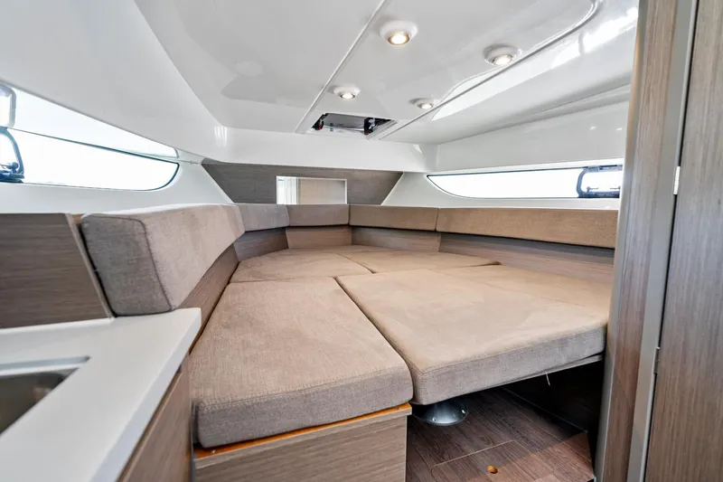  Yacht Photos Pics 2025 Beneteau Flyer 9 SUNdeck interior cabin with modern seating and sleek design.