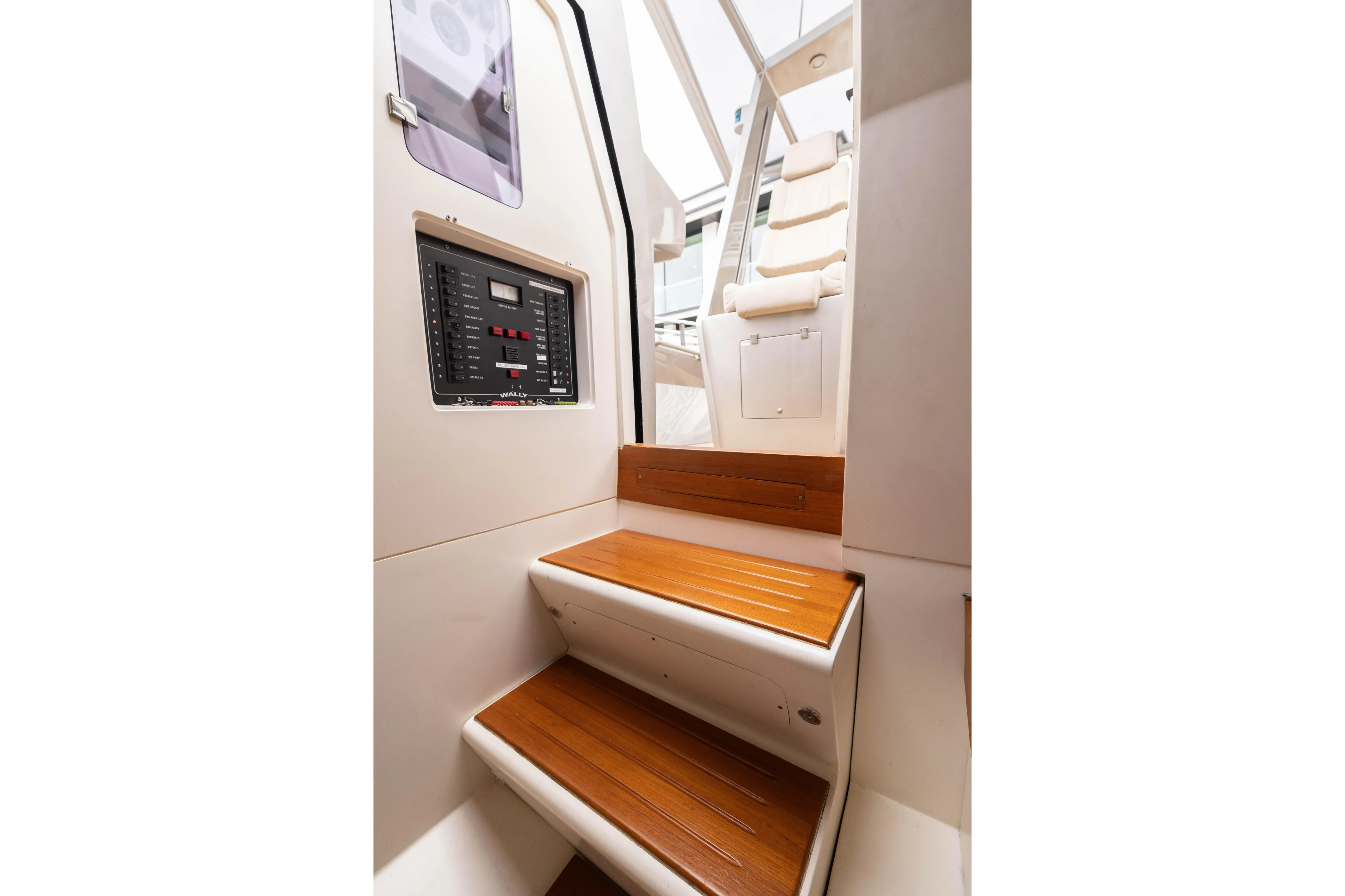 Fan Sea II Yacht Photos Pics Interior of 2005 Wally Yachts Tender Express with wooden steps and control panel.