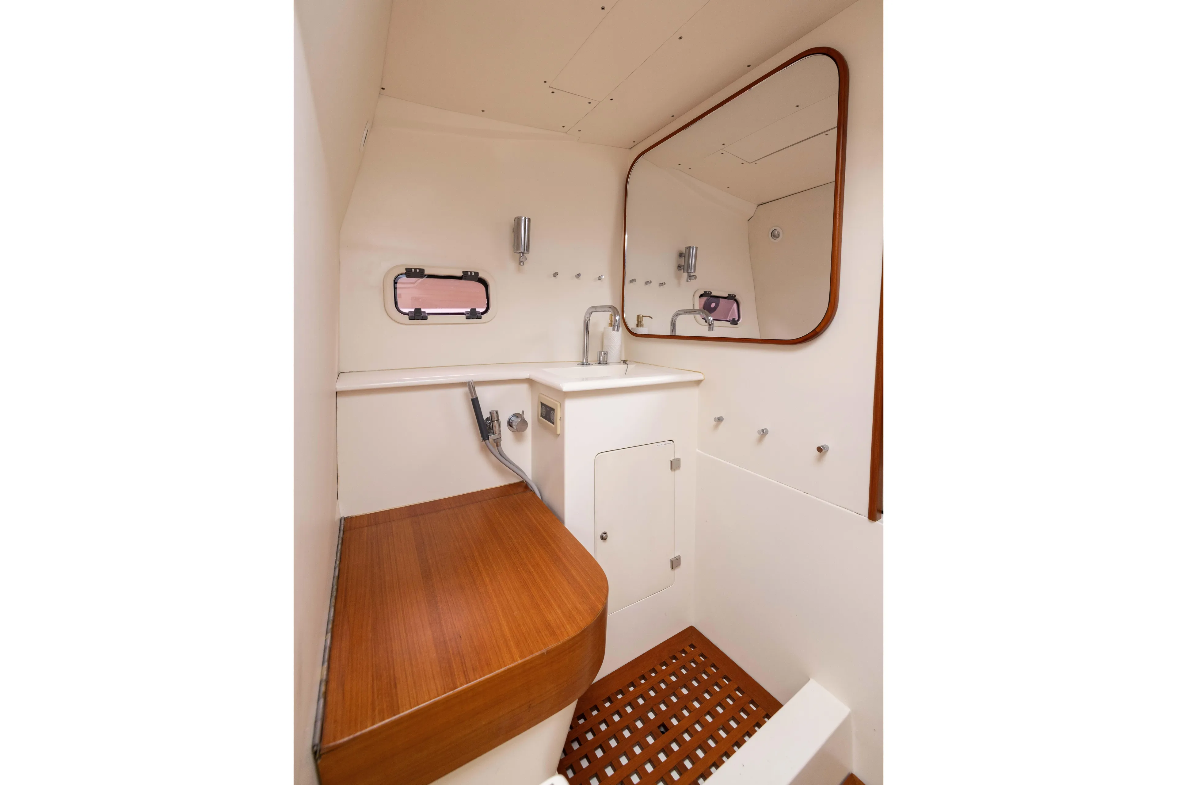 Fan Sea II Yacht Photos Pics Interior of 2005 Wally Yachts Tender Express bathroom with wooden accents and mirror.