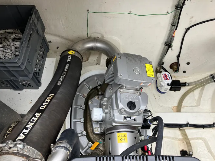  Yacht Photos Pics Engine compartment of 2016 Targa 44 CFC with Volvo Penta components and storage crate.
