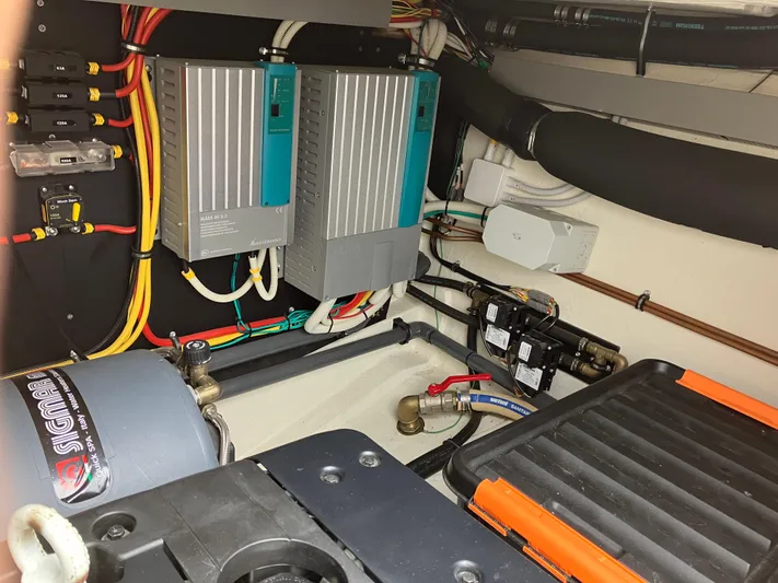  Yacht Photos Pics Engine room of a 2016 Targa 44 CFC with electrical components and wiring.