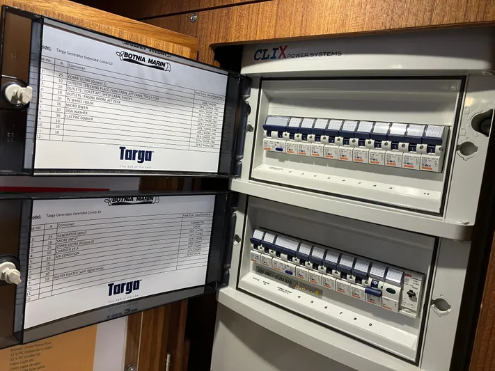  Yacht Photos Pics Electrical panel of a 2016 Targa 44 CFC boat with labeled circuit breakers.