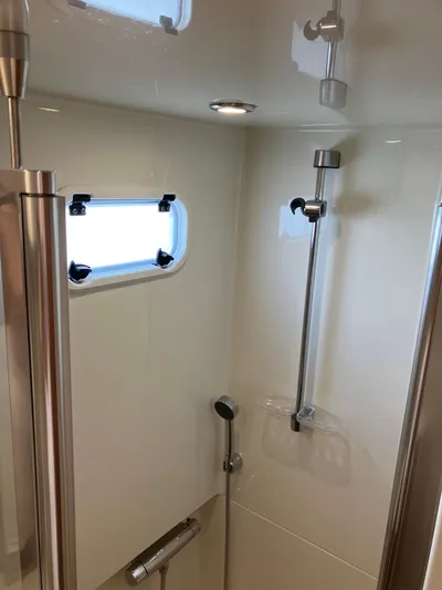  Yacht Photos Pics Shower area in 2016 Targa 44 CFC boat with window and modern fixtures.