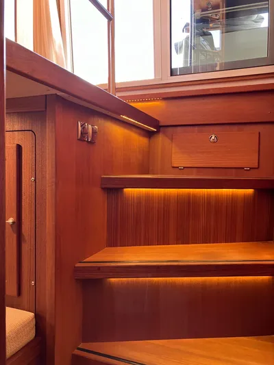  Yacht Photos Pics Wooden interior stairs with ambient lighting in a 2016 Targa 44 CFC yacht.