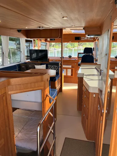  Yacht Photos Pics Interior of 2016 Targa 44 CFC yacht with wood finish and modern amenities.