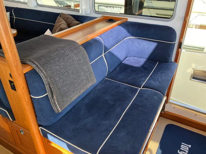  Yacht Photos Pics Luxurious blue seating area in a 2016 Targa 44 CFC boat interior.