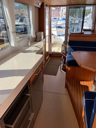  Yacht Photos Pics Interior of a 2016 Targa 44 CFC boat with modern kitchen and seating area.