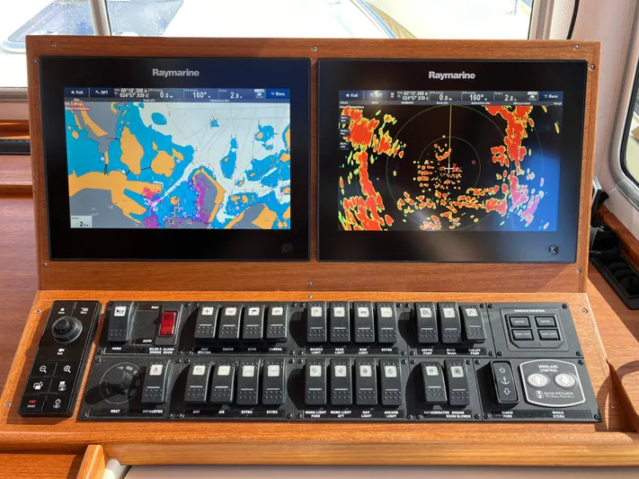  Yacht Photos Pics Control panel of 2016 Targa 44 CFC with dual Raymarine navigation displays.