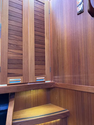  Yacht Photos Pics Wooden interior of 2016 Targa 44 CFC boat, featuring cabinets and steps.