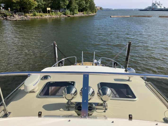  Yacht Photos Pics Targa 44 CFC 2016 boat on calm water, view from deck with scenic background.