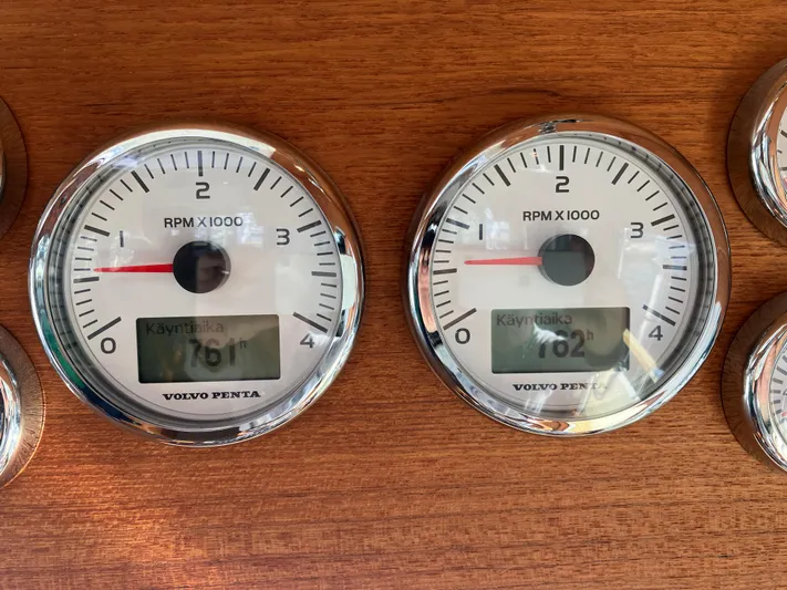  Yacht Photos Pics Targa 44 CFC 2016 boat tachometers displaying RPM and engine hours on wooden panel.