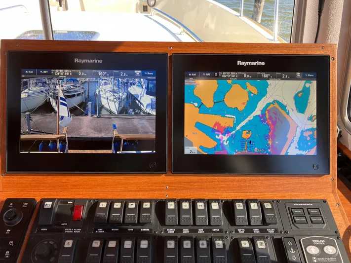  Yacht Photos Pics Control panel of 2016 Targa 44 CFC boat with Raymarine navigation displays.