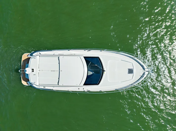 In Stock Yacht Photos Pics Aerial view of 2023 Beneteau Gran Turismo 41 yacht on green water.
