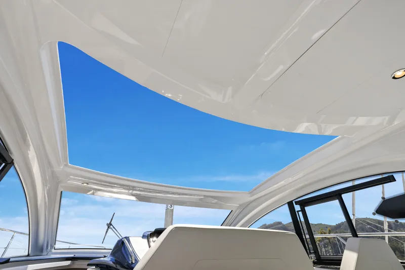 In Stock Yacht Photos Pics Interior view of 2023 Beneteau Gran Turismo 41 yacht with open sunroof.