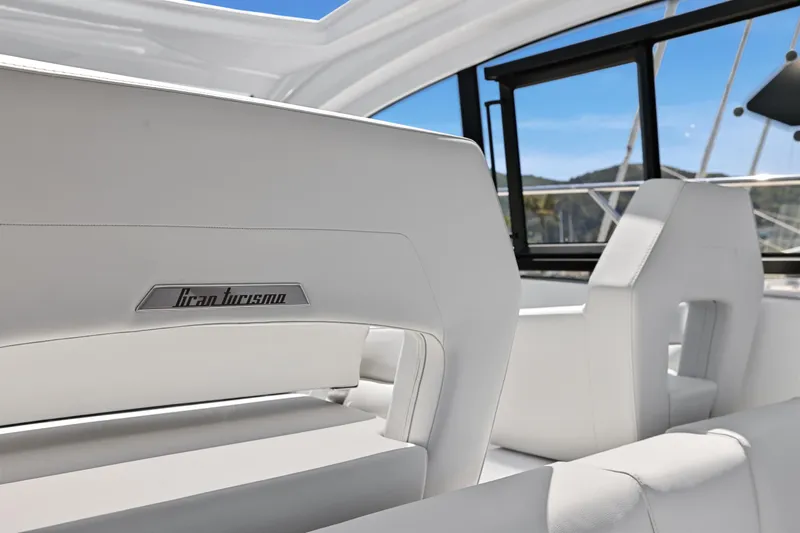 In Stock Yacht Photos Pics 2023 Beneteau Gran Turismo 41 interior with white seating and sleek design.