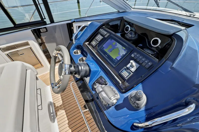 In Stock Yacht Photos Pics 2023 Beneteau Gran Turismo 41 helm with navigation system and controls.