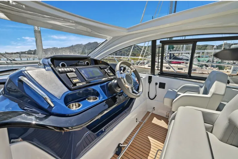 In Stock Yacht Photos Pics 2023 Beneteau Gran Turismo 41 yacht cockpit with modern controls and luxurious seating.