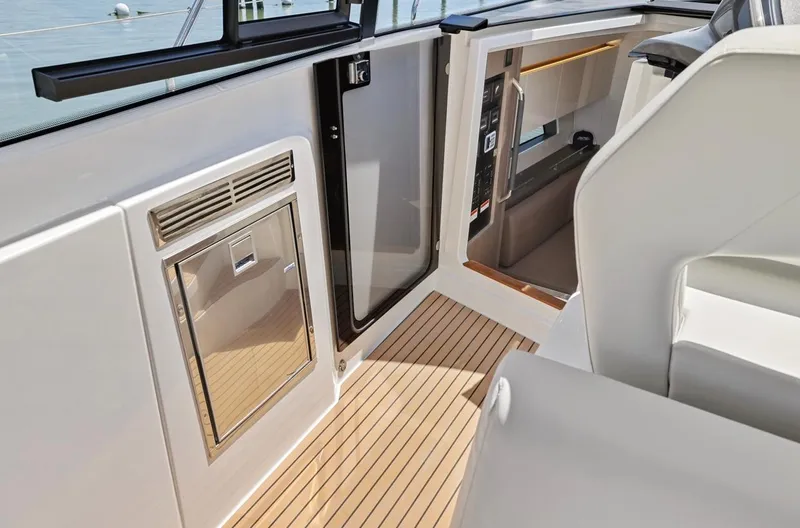 In Stock Yacht Photos Pics 2023 Beneteau Gran Turismo 41 yacht interior with sleek design and wooden flooring.