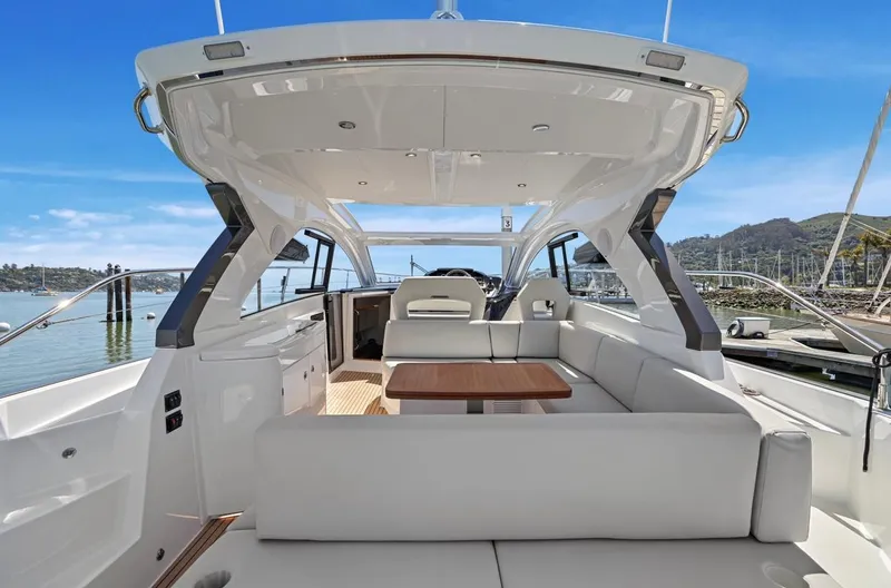 In Stock Yacht Photos Pics 2023 Beneteau Gran Turismo 41 yacht interior with sleek seating and modern design.