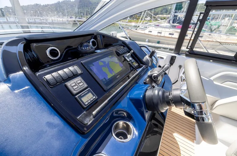 In Stock Yacht Photos Pics 2023 Beneteau Gran Turismo 41 helm with navigation controls and display screen.