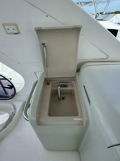  Yacht Photos Pics Azimut 64 yacht sink area, 2012 model, featuring a compact design and modern fixtures.