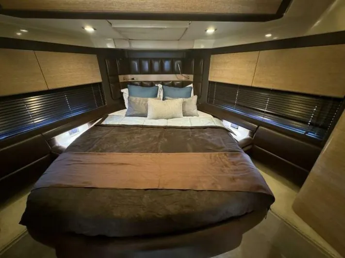  Yacht Photos Pics Luxurious bedroom interior of 2012 Azimut 64 yacht with elegant bedding and ambient lighting.