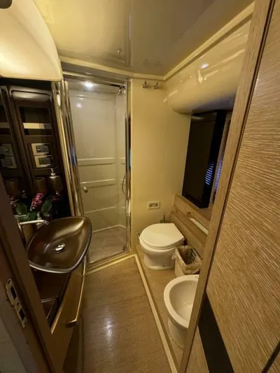  Yacht Photos Pics Luxurious bathroom in 2012 Azimut 64 yacht with modern fixtures and shower.