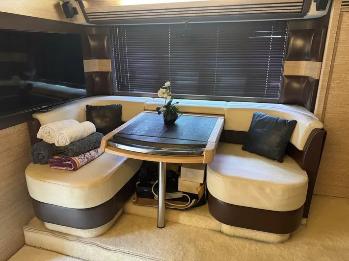 Yacht Photos Pics Luxurious interior of a 2012 Azimut 64 yacht with cozy seating and elegant decor.