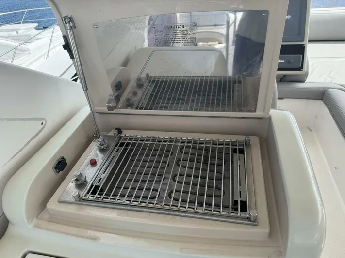  Yacht Photos Pics Outdoor grill on 2012 Azimut 64 yacht deck, featuring stainless steel grate.