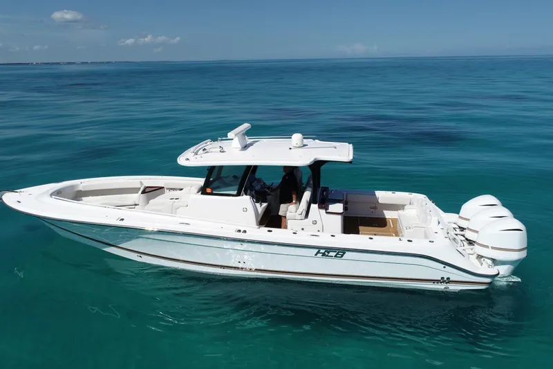 Aquamarine Yacht Photos Pics 2019 HCB 39 Speciale boat on clear blue ocean water.