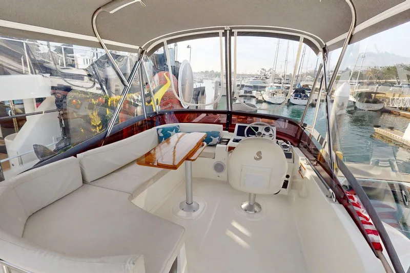 Vitamin Sea Yacht Photos Pics Flybridge of 2021 Beneteau Swift Trawler 35 with seating and helm, docked at marina.