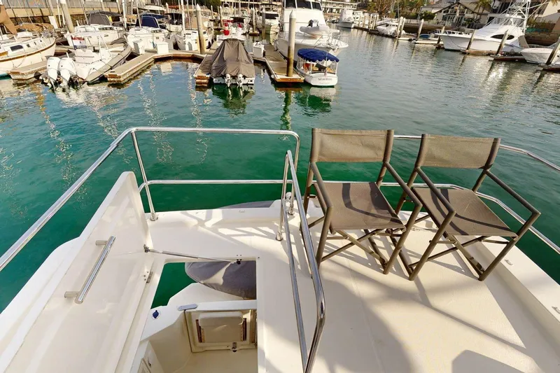 Vitamin Sea Yacht Photos Pics Flybridge view of 2021 Beneteau Swift Trawler 35, overlooking marina with docked boats.