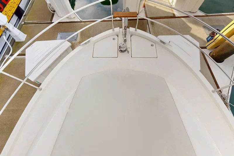 Vitamin Sea Yacht Photos Pics 2021 Beneteau Swift Trawler 35 bow view, showcasing deck and railing details.