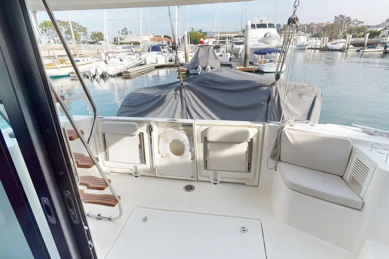 Vitamin Sea Yacht Photos Pics 2021 Beneteau Swift Trawler 35, rear deck view in marina setting.