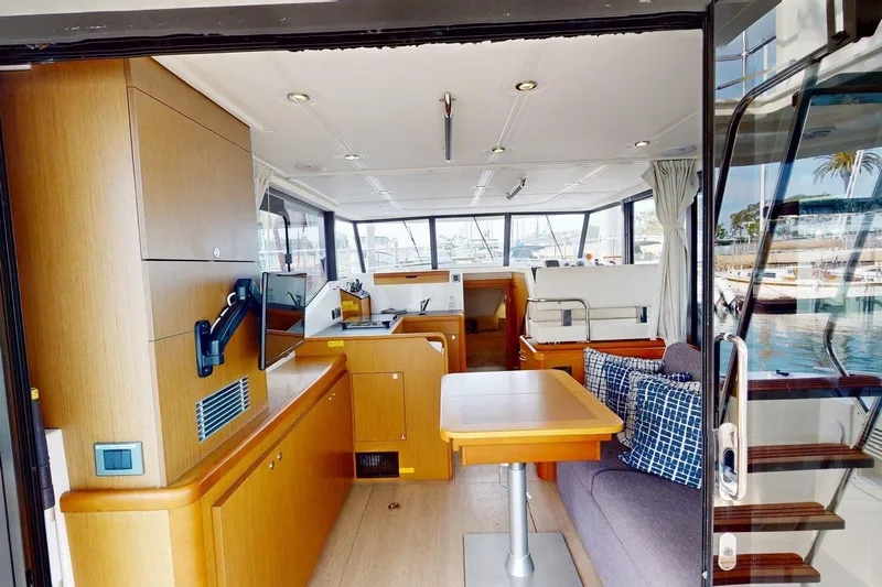 Vitamin Sea Yacht Photos Pics Interior of 2021 Beneteau Swift Trawler 35, featuring modern wood finishes and comfortable seating.