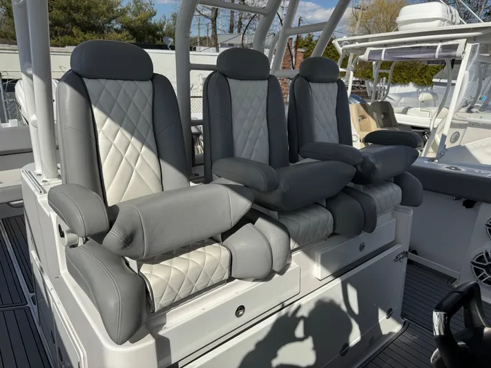  Yacht Photos Pics Luxury seating on 2022 Everglades 395cc boat with gray and white upholstery.
