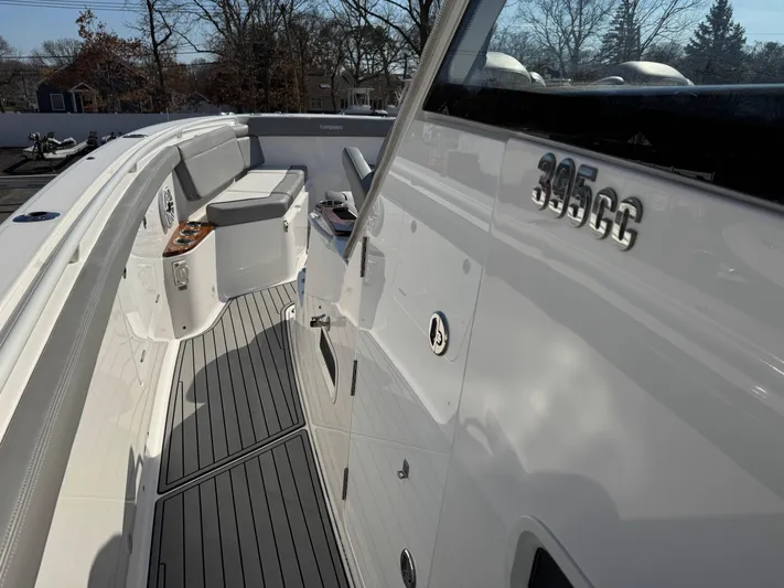  Yacht Photos Pics 2022 Everglades 395cc boat deck with seating and sleek design.