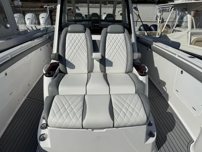  Yacht Photos Pics Luxury seating on 2022 Everglades 395cc boat with quilted white upholstery.