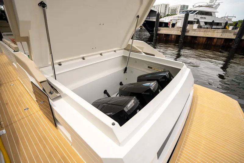  Yacht Photos Pics 2025 De Antonio Yachts D42 Open with open engine compartment at marina.