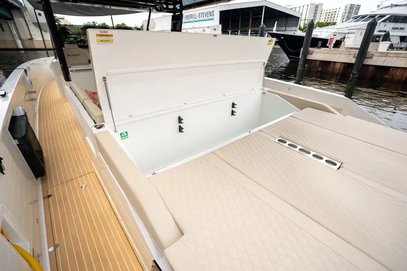  Yacht Photos Pics 2025 De Antonio Yachts D42 Open with open storage compartment, docked at marina.