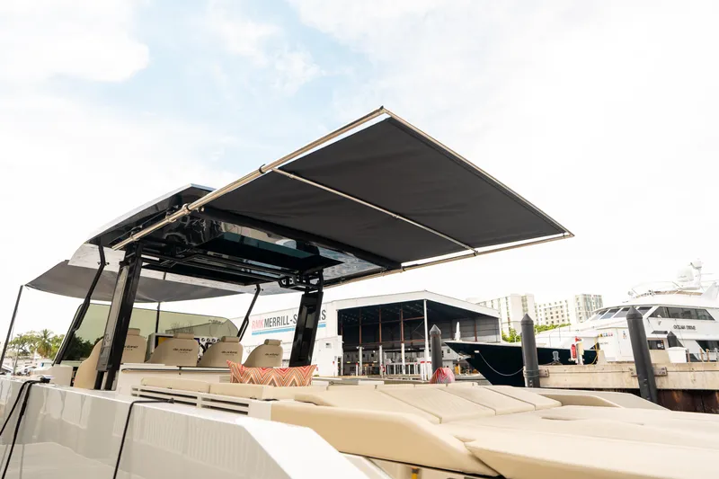  Yacht Photos Pics 2025 De Antonio Yachts D42 Open with extended sunshade at marina.