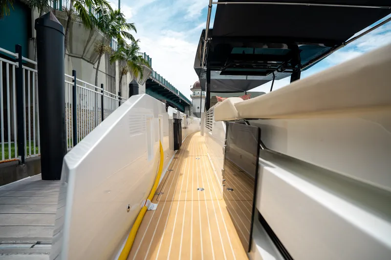  Yacht Photos Pics 2025 De Antonio Yachts D42 Open docked, showcasing sleek deck design and modern features.